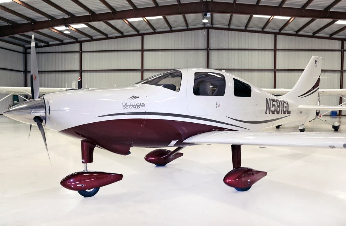 Side view of a Cessna Corvalis TT aircraft in a hangar.