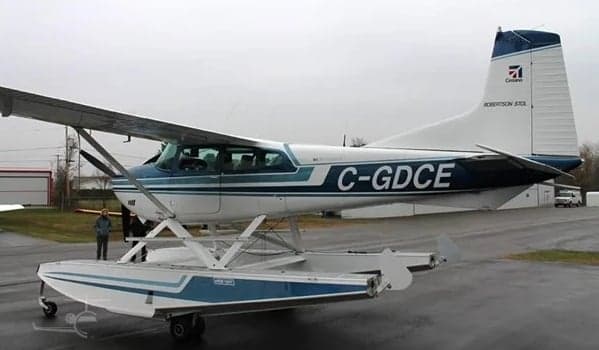 Side view of a Cessna 206 on floats with registration C-GDCE.