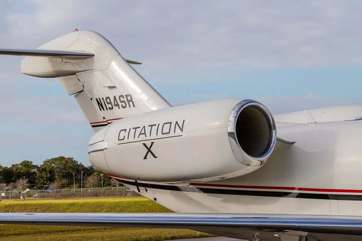 Close-up of the tail section of a Citation X aircraft with the registration N194SR.