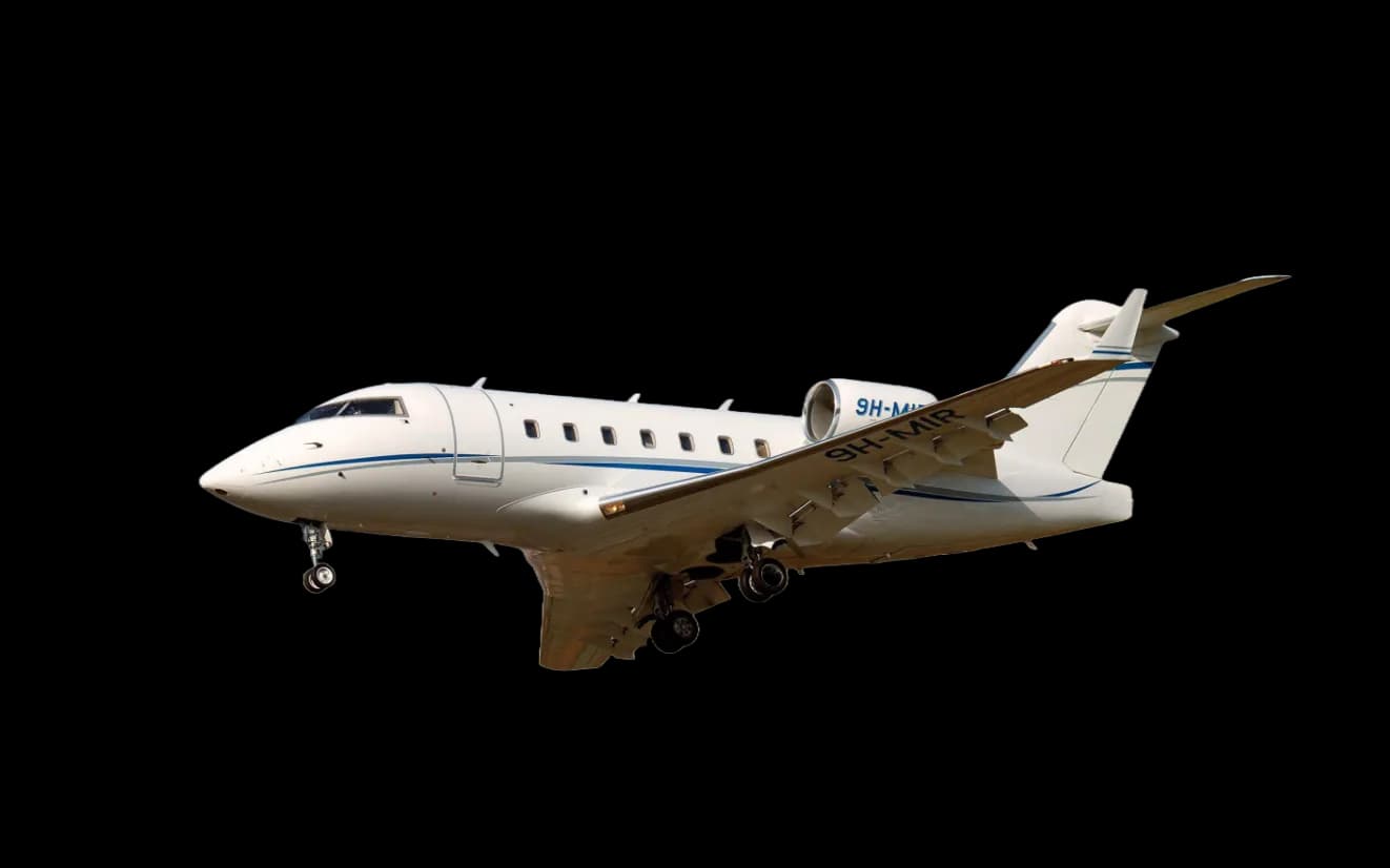 Challenger aircraft in flight with landing gear down against a black background.