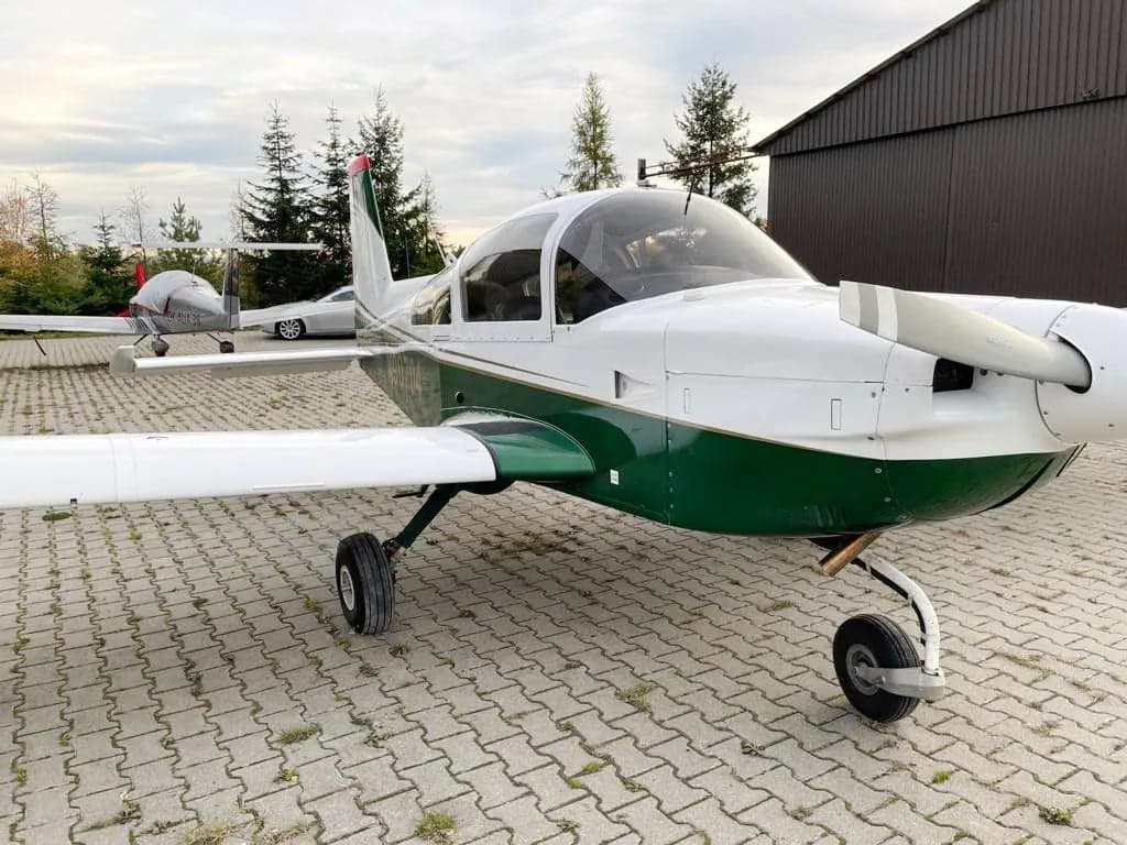 Front view of N90704 aircraft parked on the tarmac.