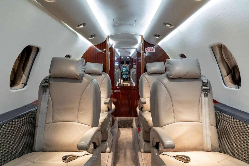 Interior of a Cessna Citation CJ3+ aircraft, showing the seating arrangement.