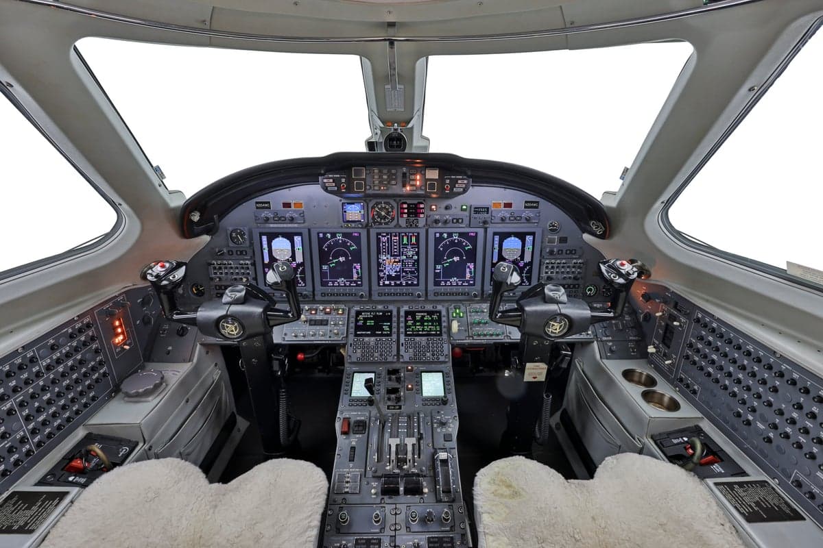 The cockpit of a Citation CJ3 aircraft, showing the instrument panel and controls.