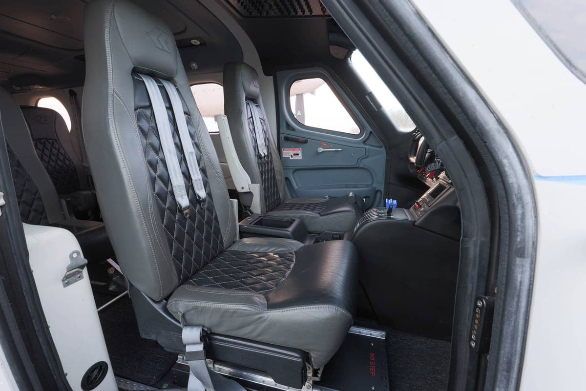 View of the cabin seats and cockpit area of the aircraft.