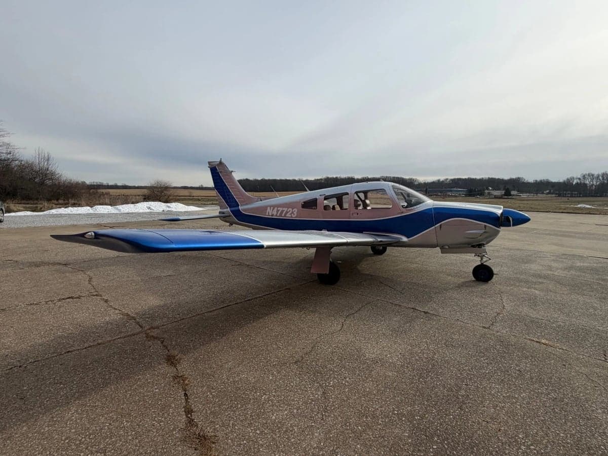 A Piper PA-28-181 Archer II aircraft with registration N47723 parked on the tarmac.
