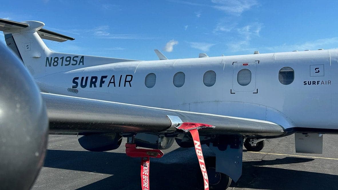 Close up of the tail number and SURFAIR logo on Pilatus PC-12 aircraft N819SA.