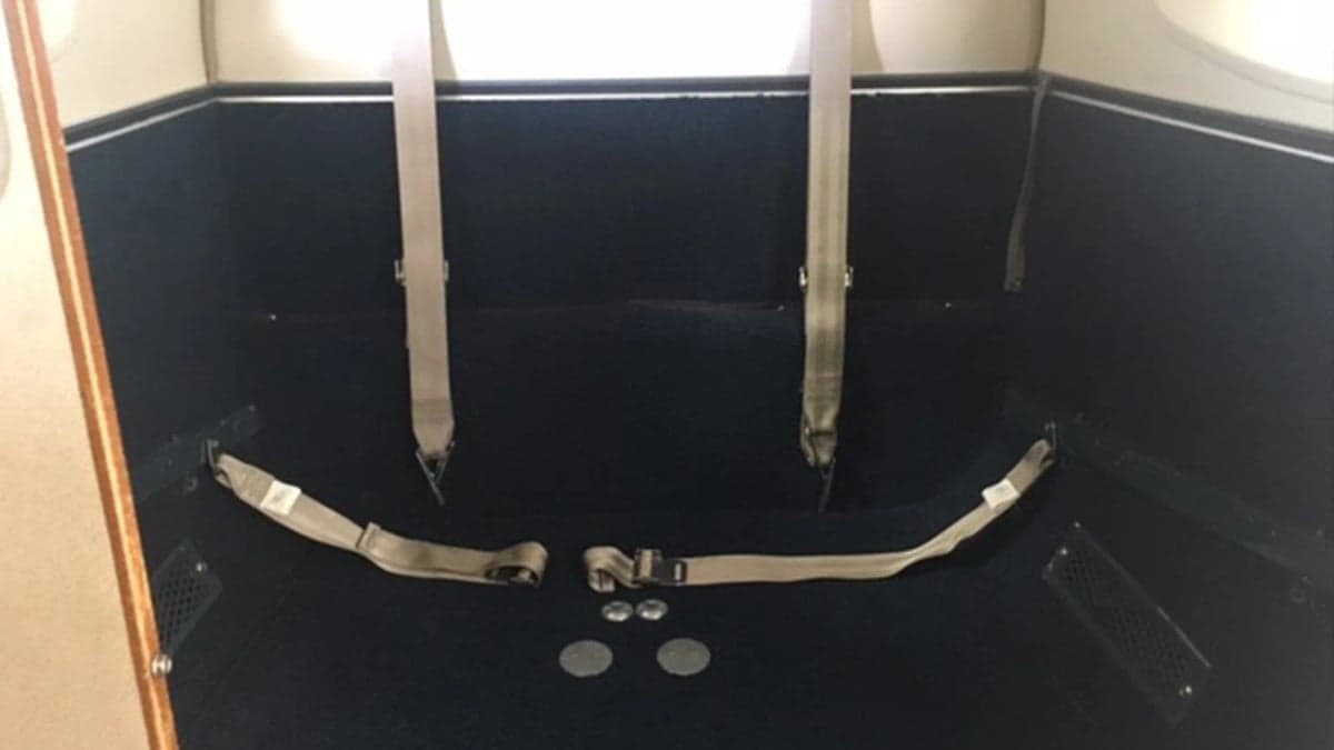 Interior view of the aircraft with seatbelts.