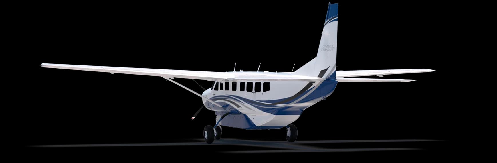 Stock photo of a Cessna Grand Caravan with blue and white paint scheme, rear quarter view.