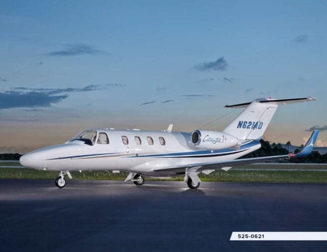 A Citation Jet CJ1+ aircraft with registration N621AD is parked on the tarmac.