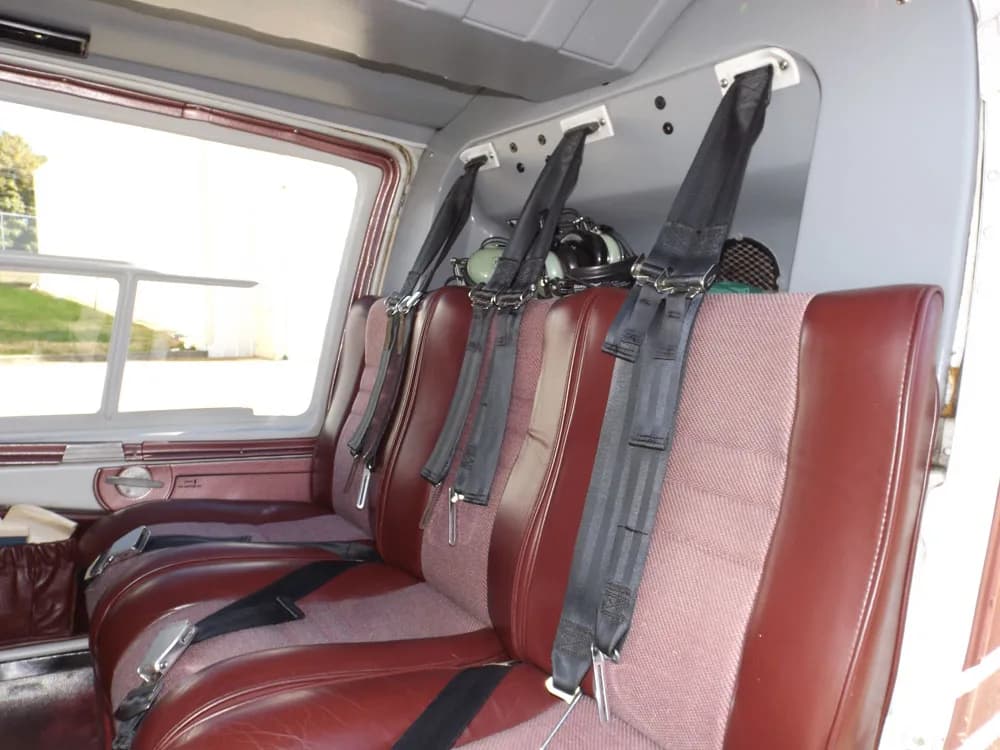 The interior of the Bell 206B JetRanger III shows the rear passenger seats.