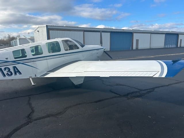 Close-up of the wing and tail of Beechcraft Bonanza N6613A.