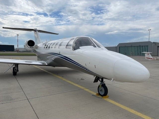 A Cessna Citation M2 aircraft parked on the tarmac.