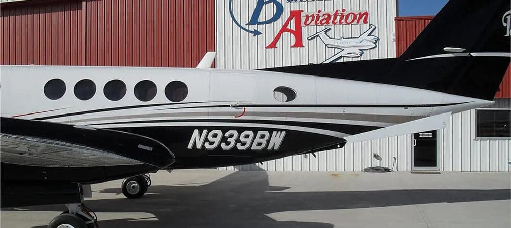 Close-up of the tail section of a King Air aircraft with registration number N939BW.