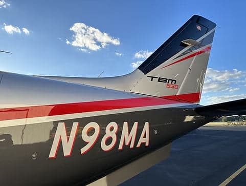 The tail of a TBM 930 aircraft with the registration number N98MA.
