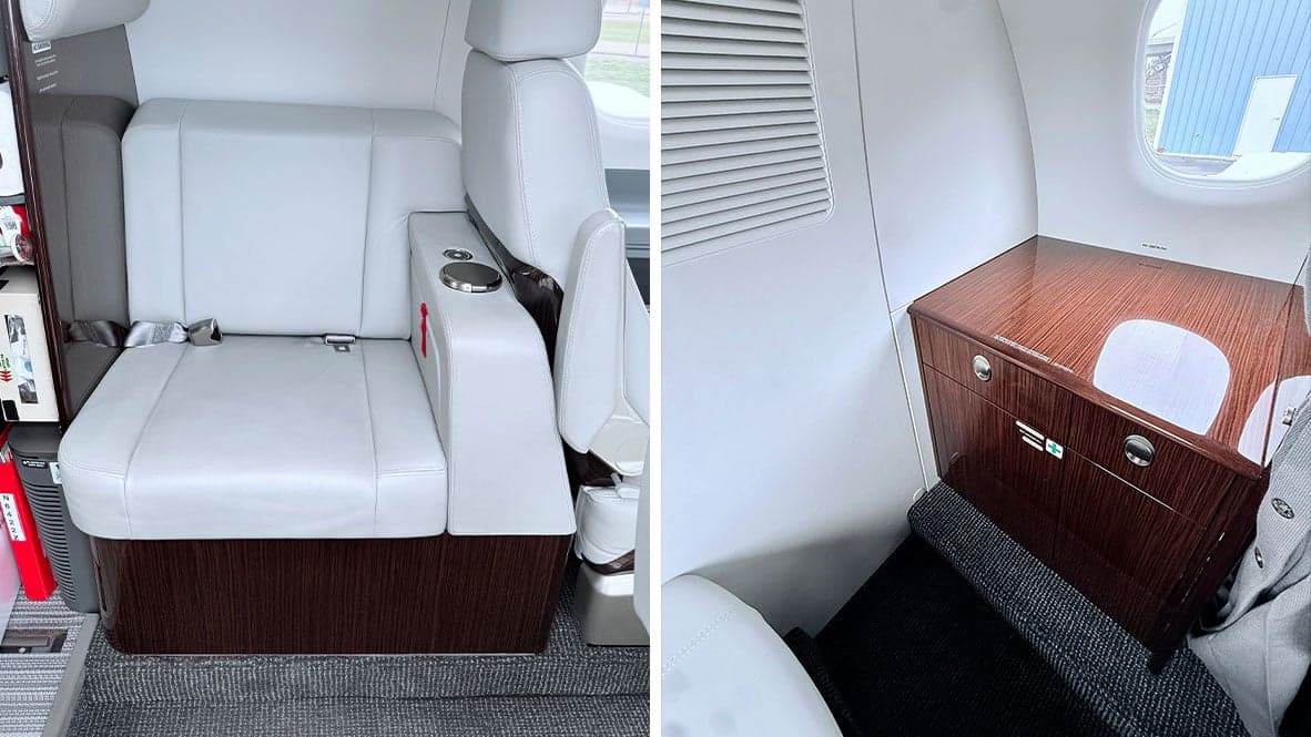 Interior cabin view of N6422Z Phenom 300E with seats and storage.