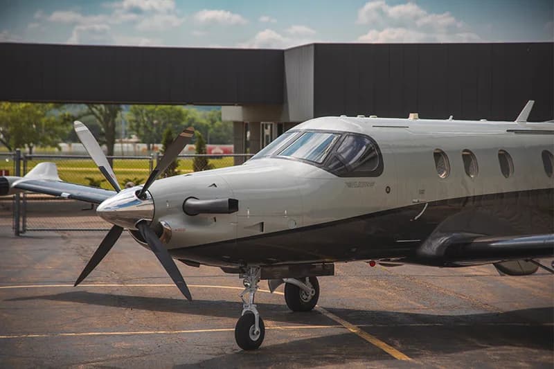 Close-up of a Pilatus PC-12 on the tarmac.