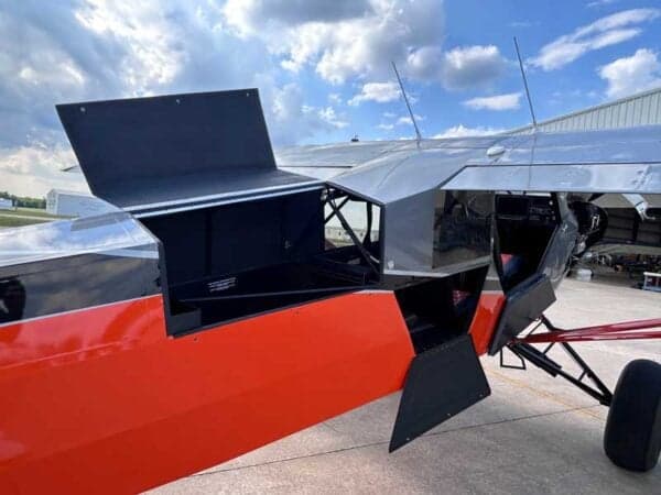 Close-up of the aircraft's open baggage compartment.