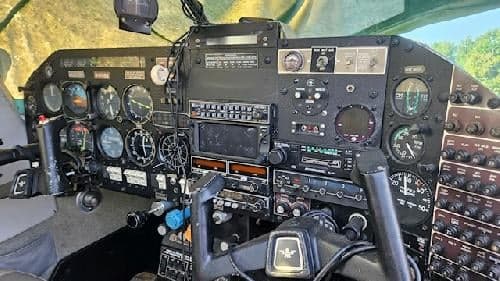 Close-up view of the aircraft's instrument panel and control yokes.