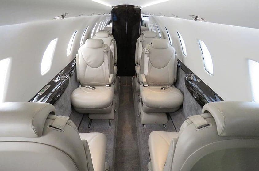 View of the aircraft's interior cabin with leather seats.
