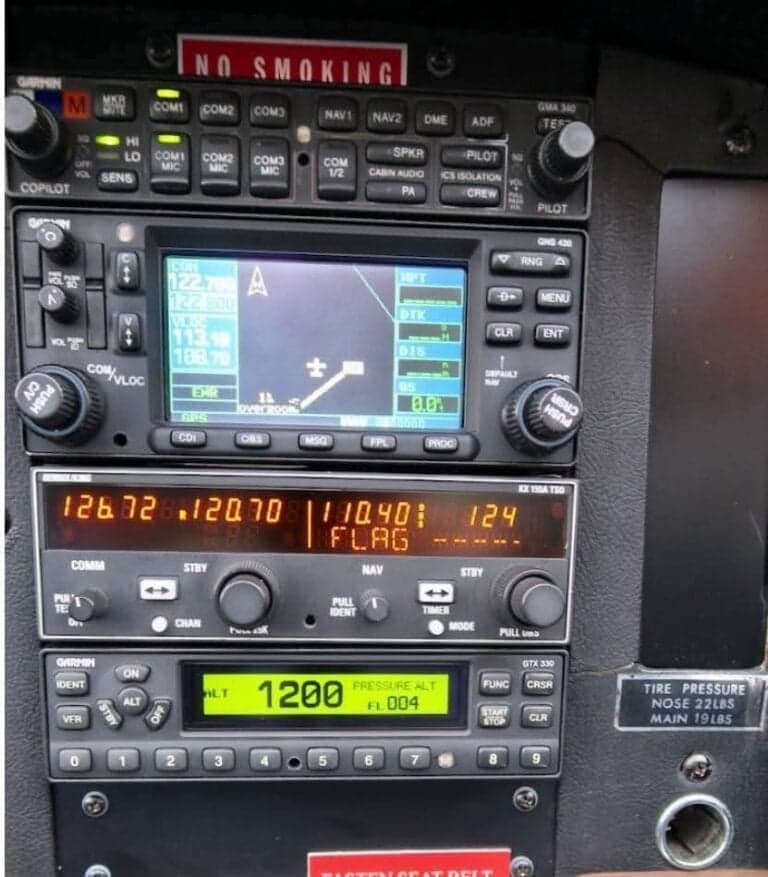 Close-up of the aircraft's avionics stack, including GPS and radio controls.