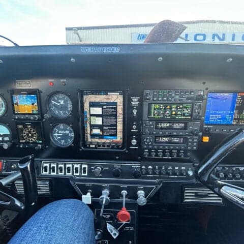 The cockpit of an aircraft with a modern avionics suite is shown.