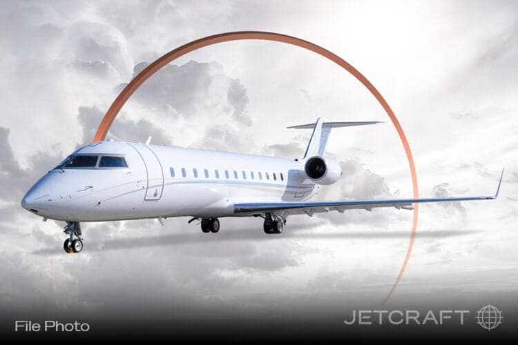 A Bombardier Challenger business jet is shown in a marketing photo.