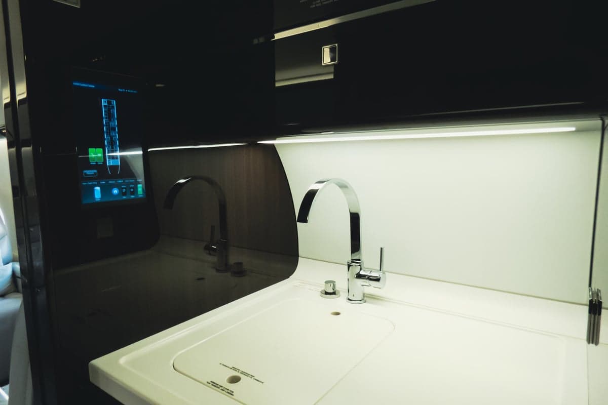 Interior view of the aircraft galley with sink and faucet.