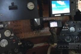 A view of the instrument panel in the cockpit.