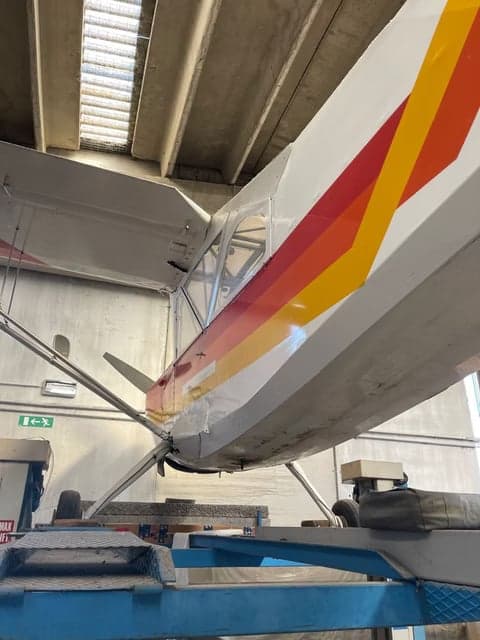 I-AEGS aircraft parked on the tarmac, side view.