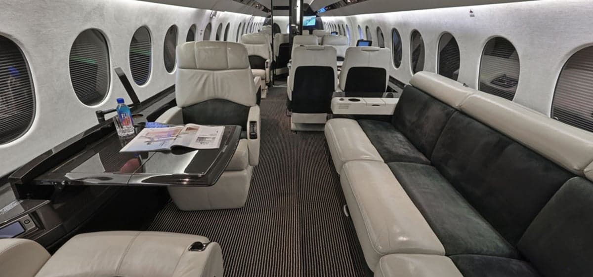 View of the aircraft interior showing seating and a divan.