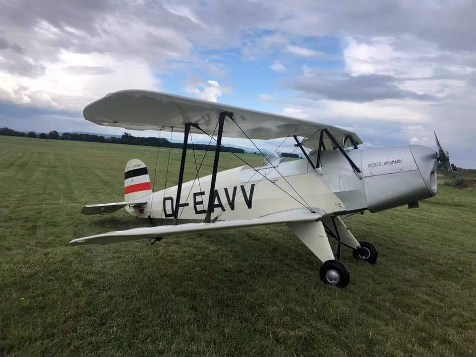 D-EAVV biplane parked on a grassy airfield.