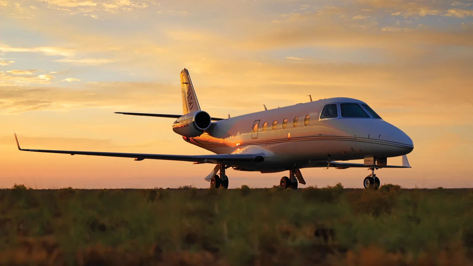 Gulfstream G150 on the ground at sunset.