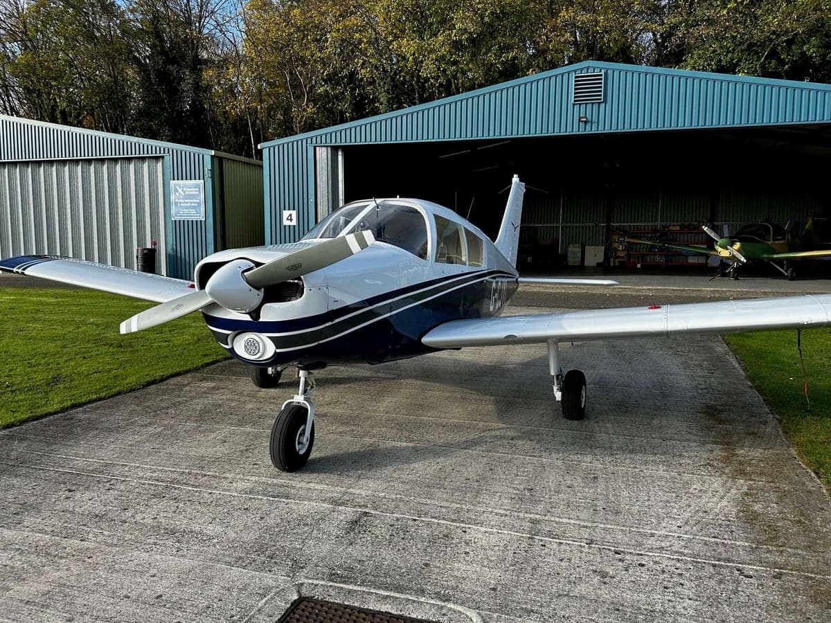Front view of a Piper PA-28-161 Warrior II aircraft on the ground.
