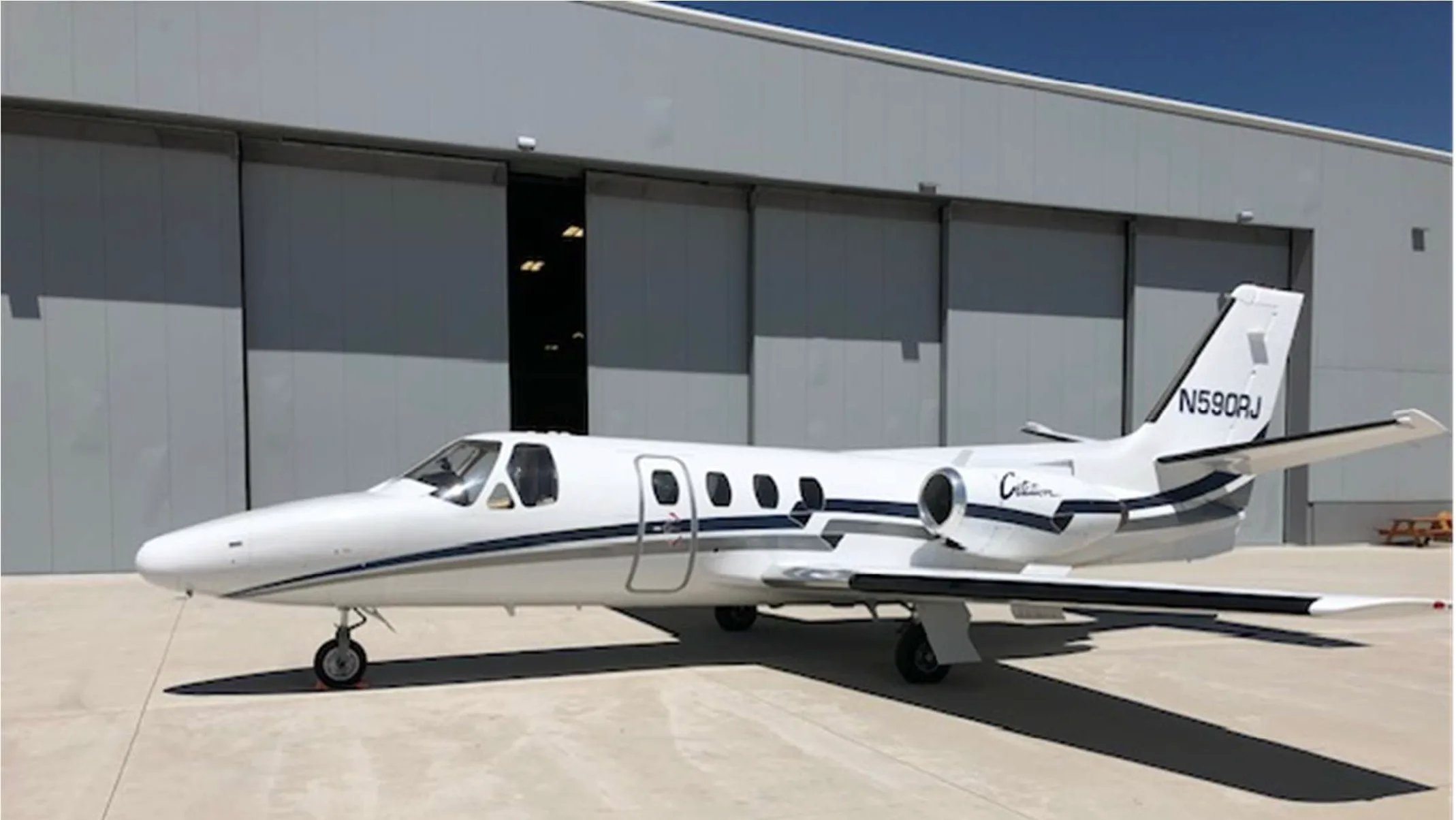 Cessna Citation N590RJ parked on the tarmac.