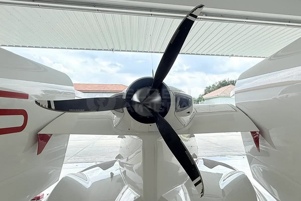 Close-up rear view of the propeller and tail of a white Icon A5 aircraft.