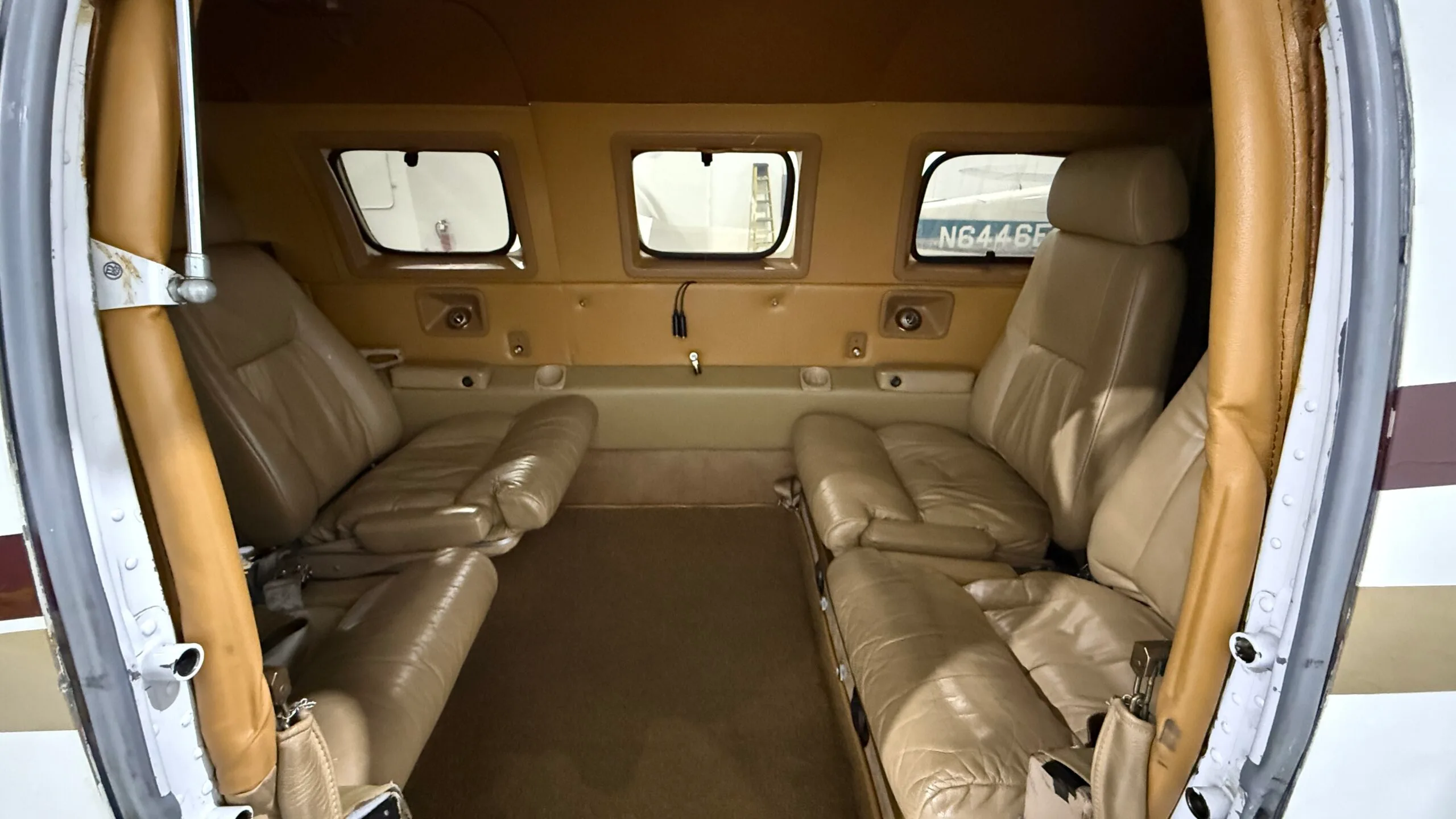 View of the aircraft interior with leather seats.