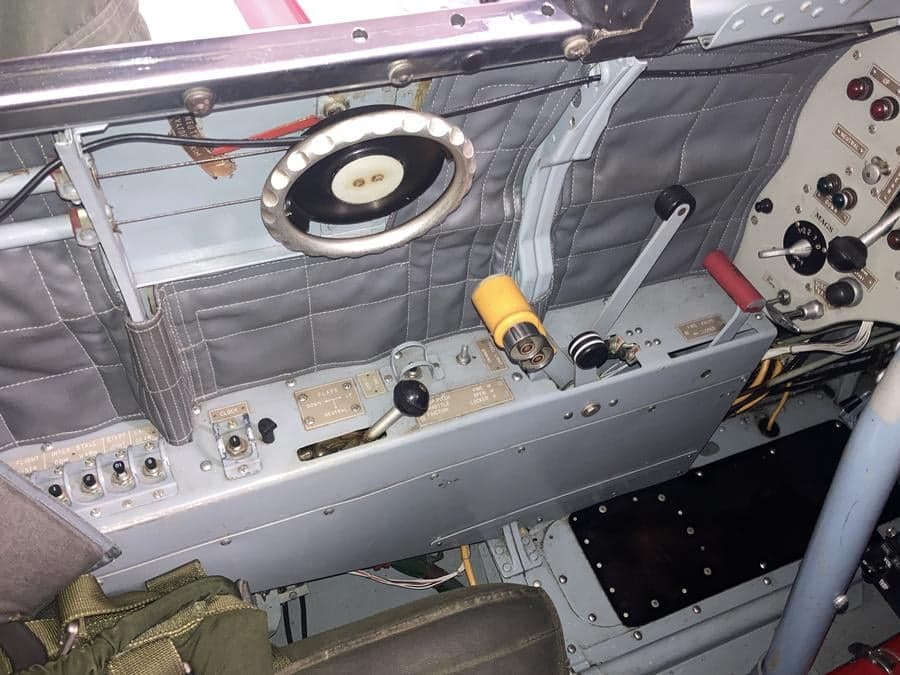 View of the side console and controls inside the cockpit of an aircraft.