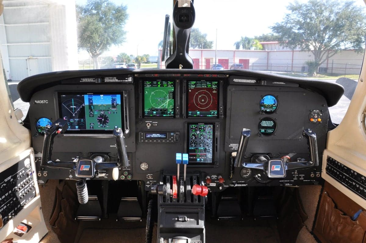Detailed view of the aircraft cockpit featuring modern avionics and instrument panel.