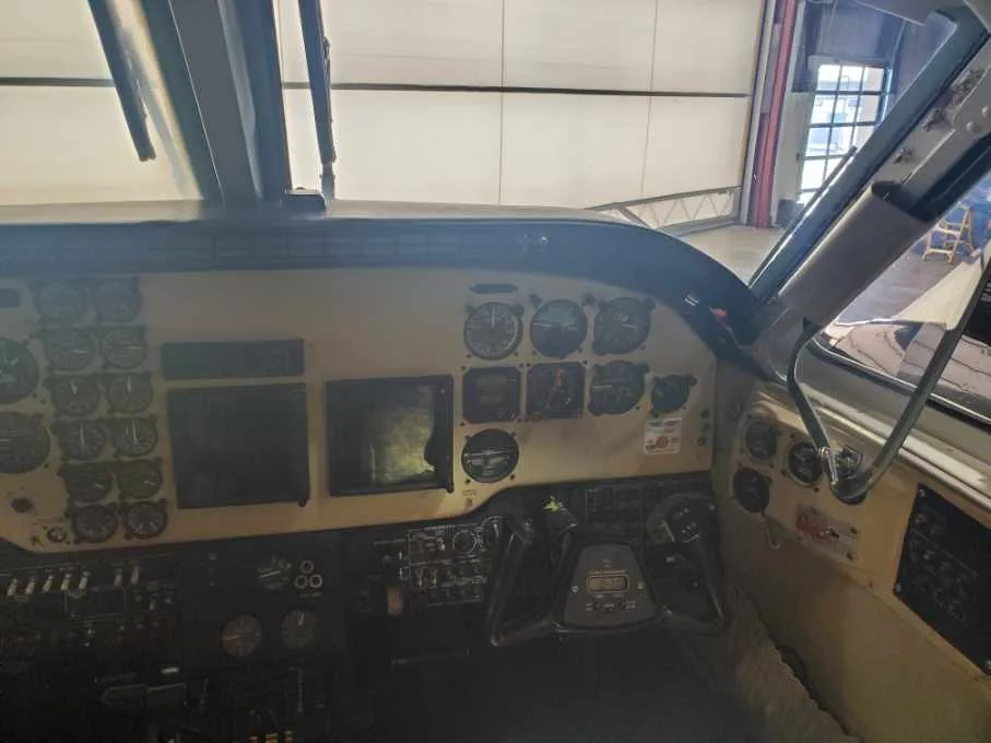 The cockpit instrument panel of a Beechcraft King Air 90, showing various gauges and controls from the pilot's perspective.