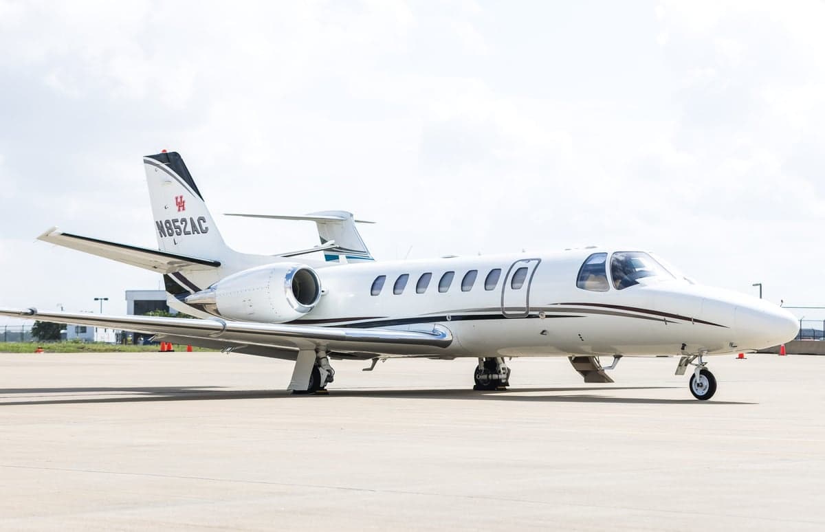 A white Cessna Citation CJ3 on the tarmac.