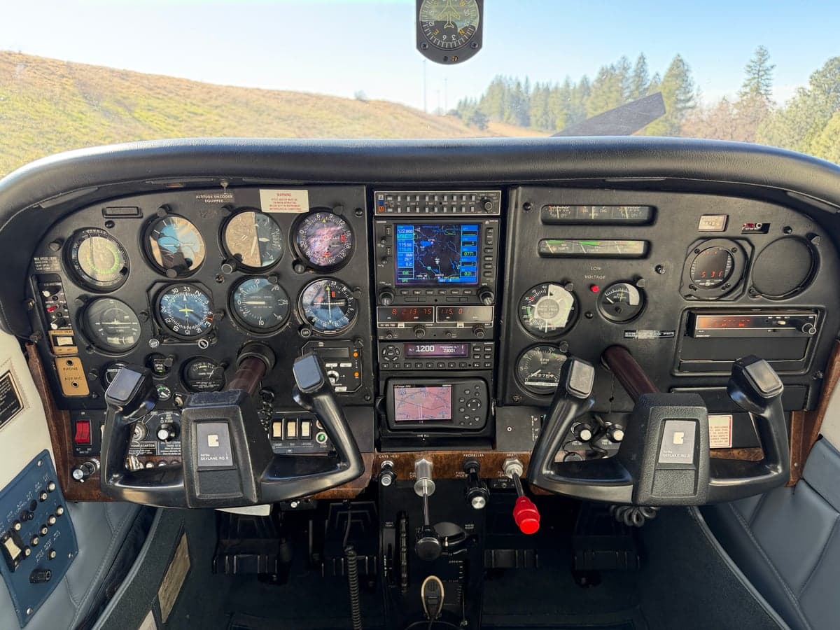 The cockpit of the aircraft features a full instrument panel and control yokes.