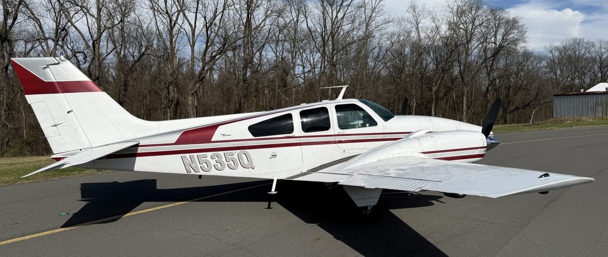 N535Q Beechcraft on the tarmac with a white and maroon paint scheme.
