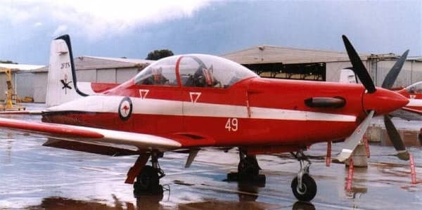 A23-049 aircraft parked on the tarmac.