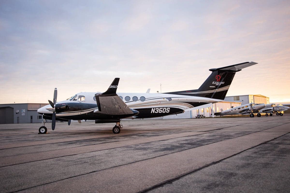 A King Air 350i aircraft with registration N360S is parked on the tarmac.