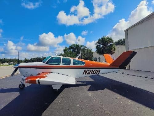 Side view of the N210R aircraft on the ground.