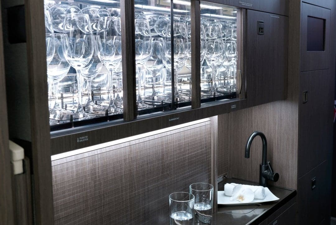 Interior of the aircraft featuring a glassware display and a sink.
