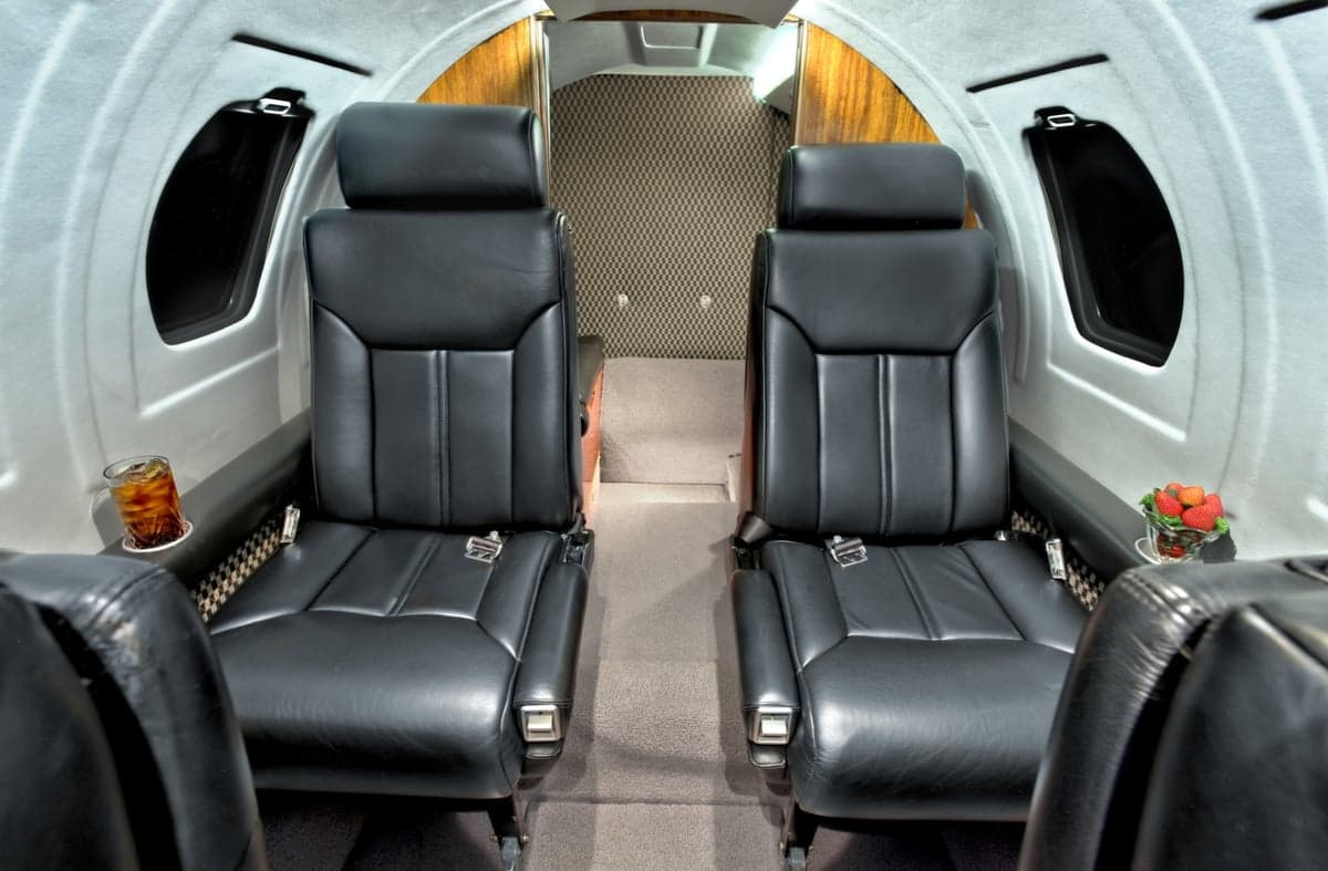 The interior of the Cessna Citation CJ1+ features two forward-facing leather seats.