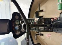 View of the helicopter cockpit with instrument panel.