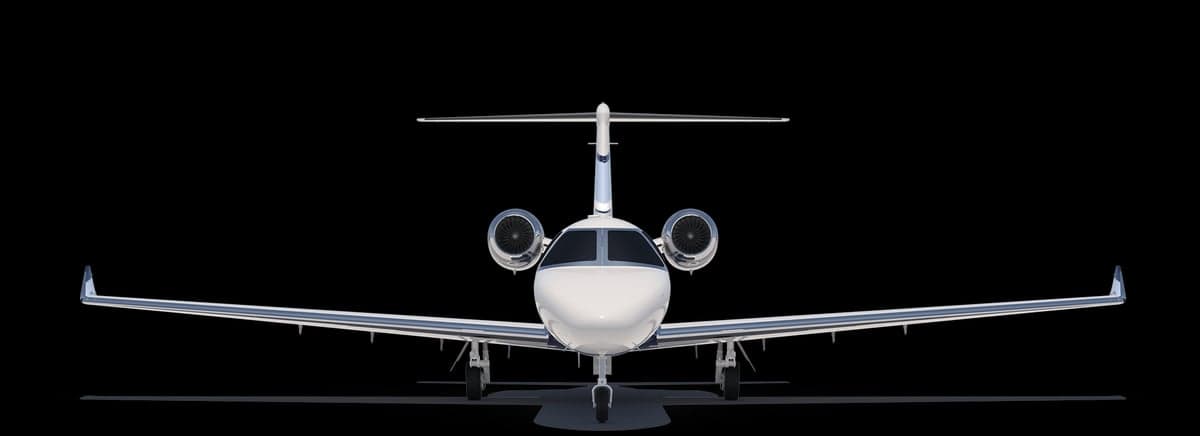 A blue and white Citation CJ4 jet on a black background.
