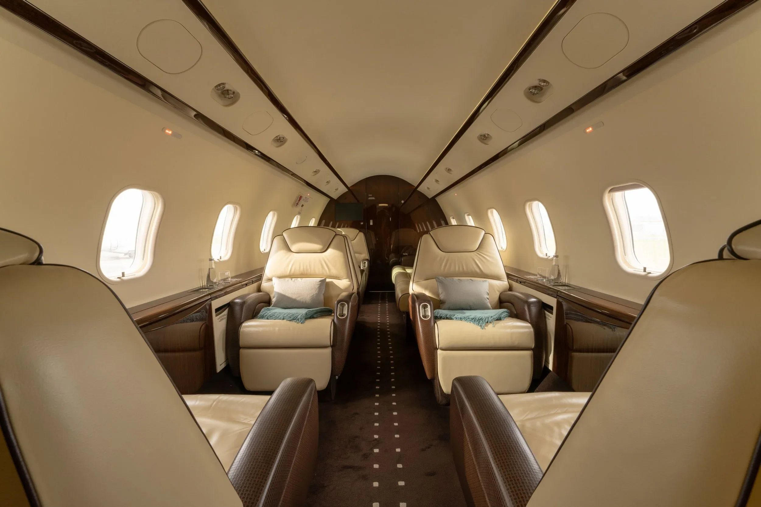 Cabin interior with tan leather seats.